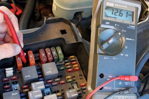 Technician carrying out auto electrical repairs in Coventry