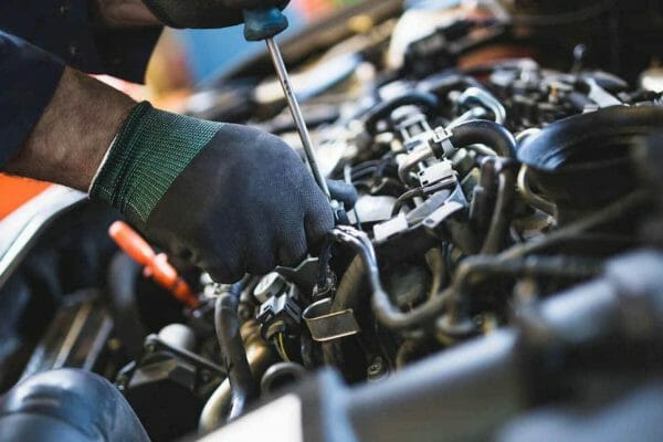 Technician carrying out vehicle repairs